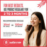 Bottle of Nature's Hive BP Care Herbal Juice, 1 L, showing the label and herbal ingredients in a clear, natural setting.