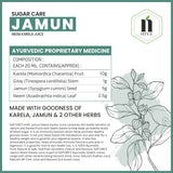 Bottle of Nature's Hive Jamun Neem Karela Herbal Juice, 1 liter, with fresh herbs and fruits visible in the image.