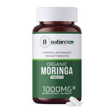 Nature's Hive Moringa Tablets herbal supplement bottle with 60 tablets, natural green label and cap.