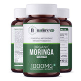 Nature's Hive Moringa Tablets herbal supplement bottle with 60 tablets, natural health product for wellness and energy.